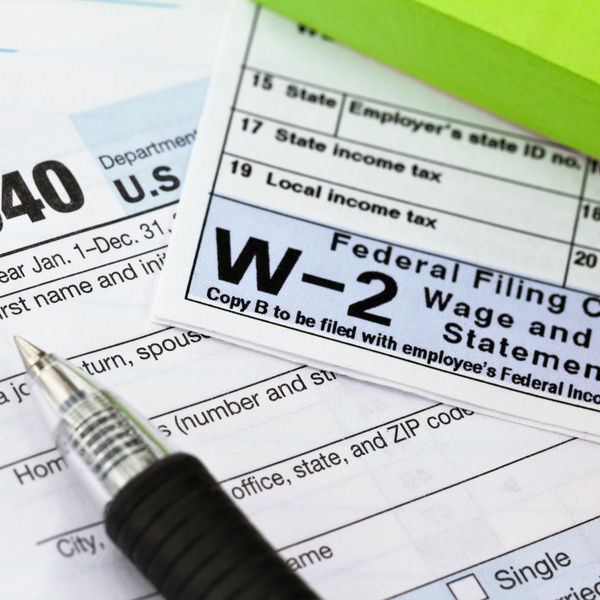 1040 income tax form and w-2 wage statement. Tax preparation concept.