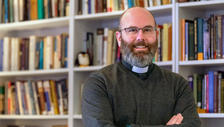 Man in Library with Bookshelves