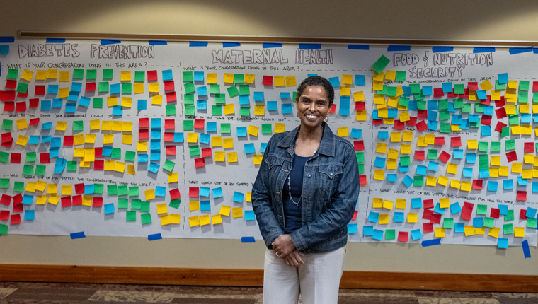 A feedback board divided into three health-focused sections—Diabetes Prevention, Maternal Health, and Food & Nutrition Security—covered with colorful sticky notes capturing community input and ideas. The setup reflects an interactive session aimed at promoting public health initiatives.