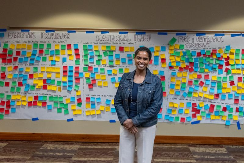 A feedback board divided into three health-focused sections—Diabetes Prevention, Maternal Health, and Food & Nutrition Security—covered with colorful sticky notes capturing community input and ideas. The setup reflects an interactive session aimed at promoting public health initiatives.