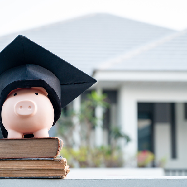 piggy bank and graduation cap University level. Concept of saving money for education.