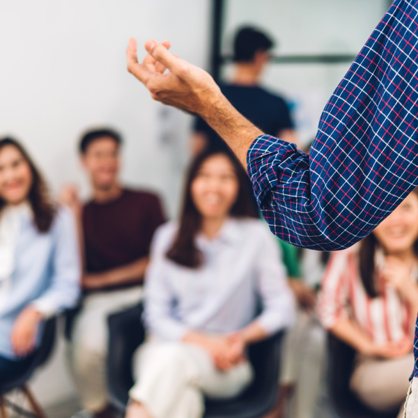 Businessman coach speaker presentation and discussing meeting strategy sharing idea.Creative team casual business people seminar and brainstorm in conference seminar at hall.presentation and teamwork concept